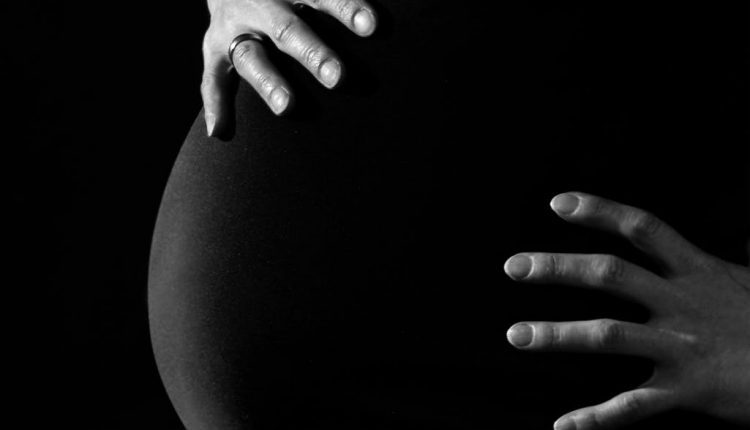 pregnancy-woman-belly-hands-46207